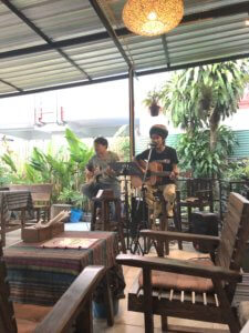 Live band in Tikky's Cafe - two men playing guitar and singing 