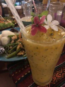 Vegetables and Rice dish with Passionfruit daiquiri drink and flower in the drink