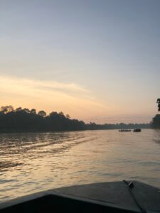 The river from the front of the boat with the sun rising