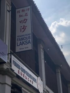 Shop sign for Penang Road Famous Laksa
