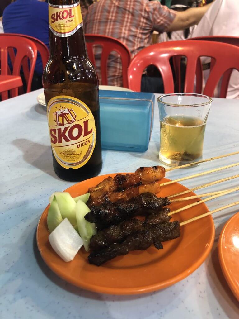 Satay Chicken and Skol Beer at Jalan Alor in Kuala Lumpur Malaysia