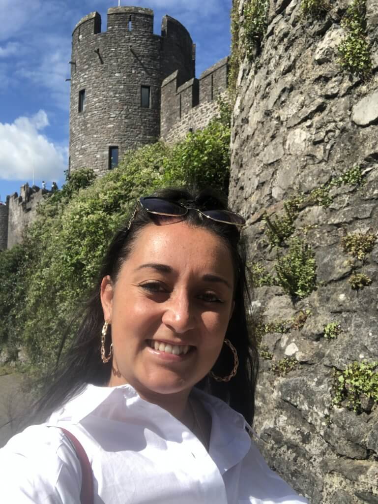 Me outside Pembroke Castle for places to visit in Pembrokeshire South