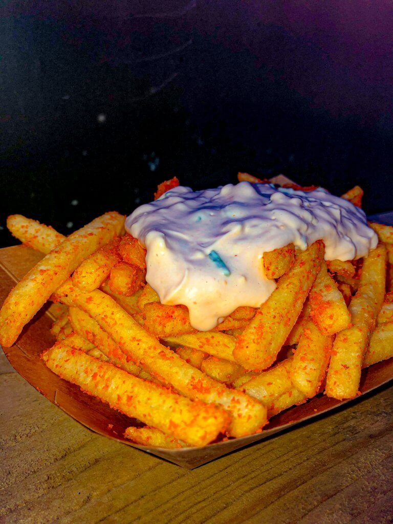 Bombay Fries with thousand island sauce in brown paper bowl - side view from Tukka Tuk Goodsheds Barry