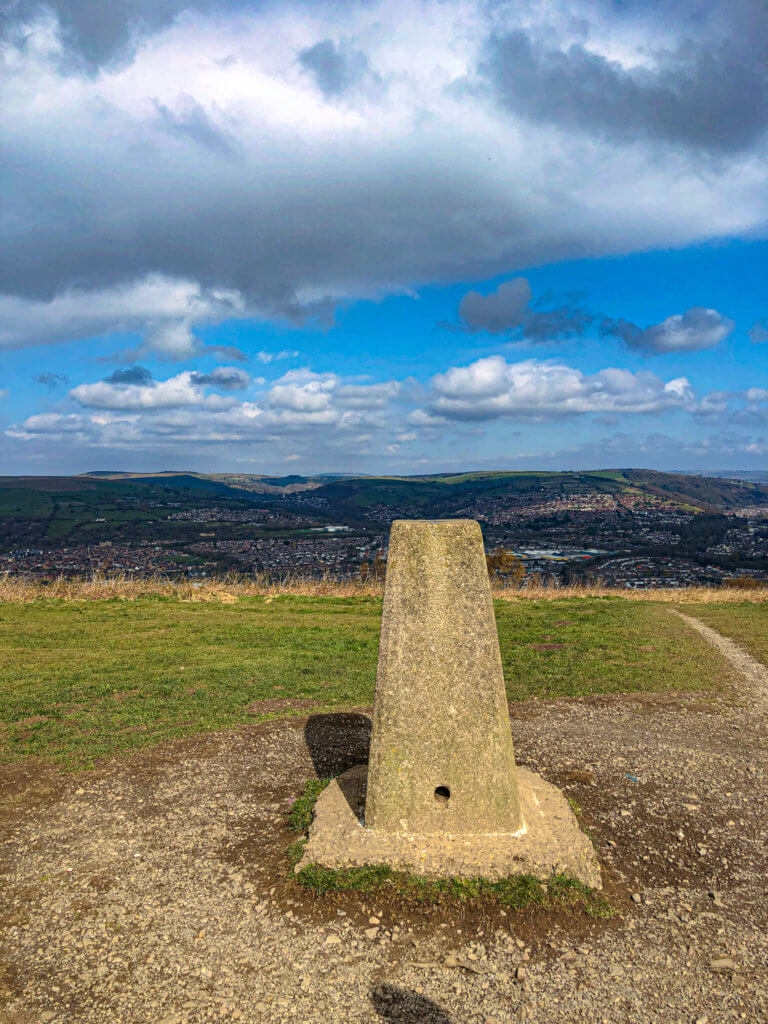 Statue marking the top of Caerphilly Mountain walk with landscape in background 