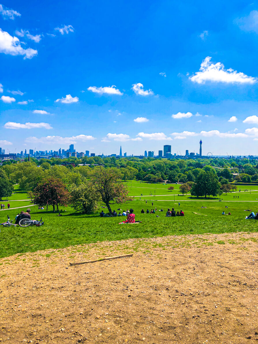 Top of Primrose Hill with London skyline in the background