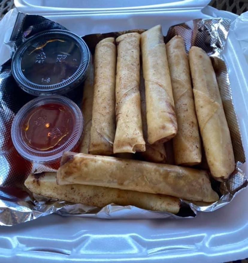 Close up picture of Lumpia from Philippines with two dipping sauces. Credit to Noel from This Hawaii Life.