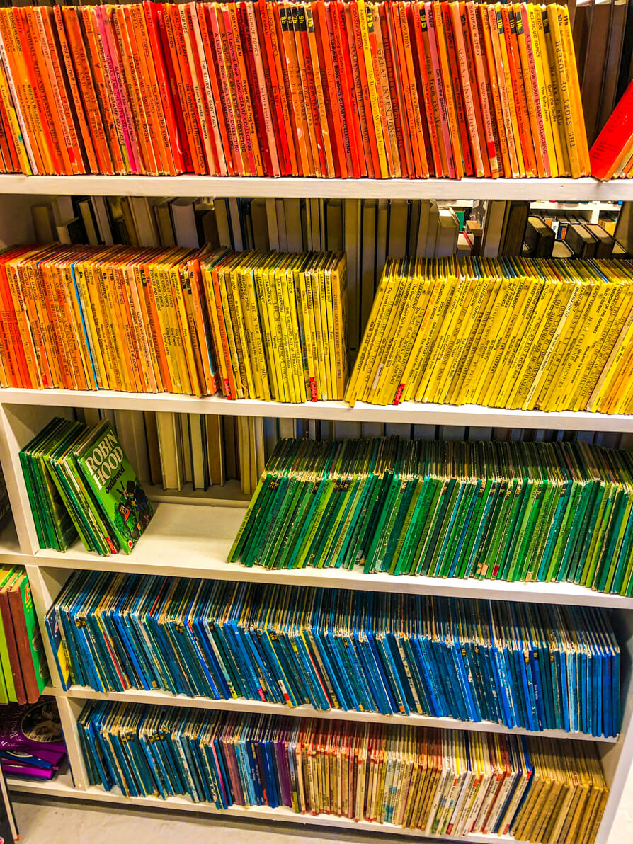 Colour coordinated books in Green Ink Booksellers Hay on Wye