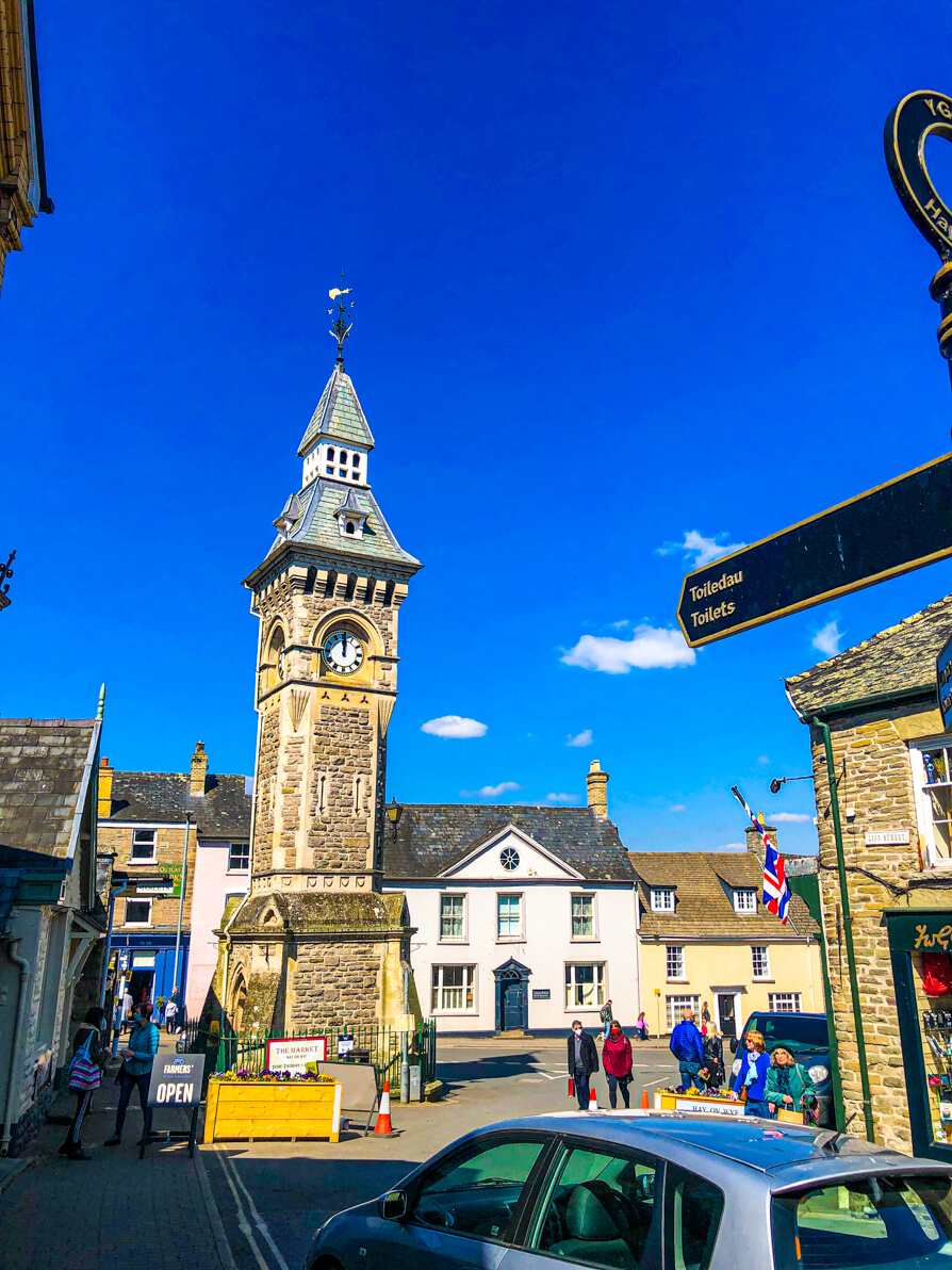 Town Centre of Hay on Wye with clock tower in centre of picture and Broad Street in background
