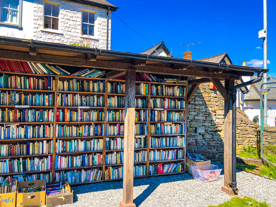 Right hand bookshelf of honesty bookshop in Hay on Wye Castle
