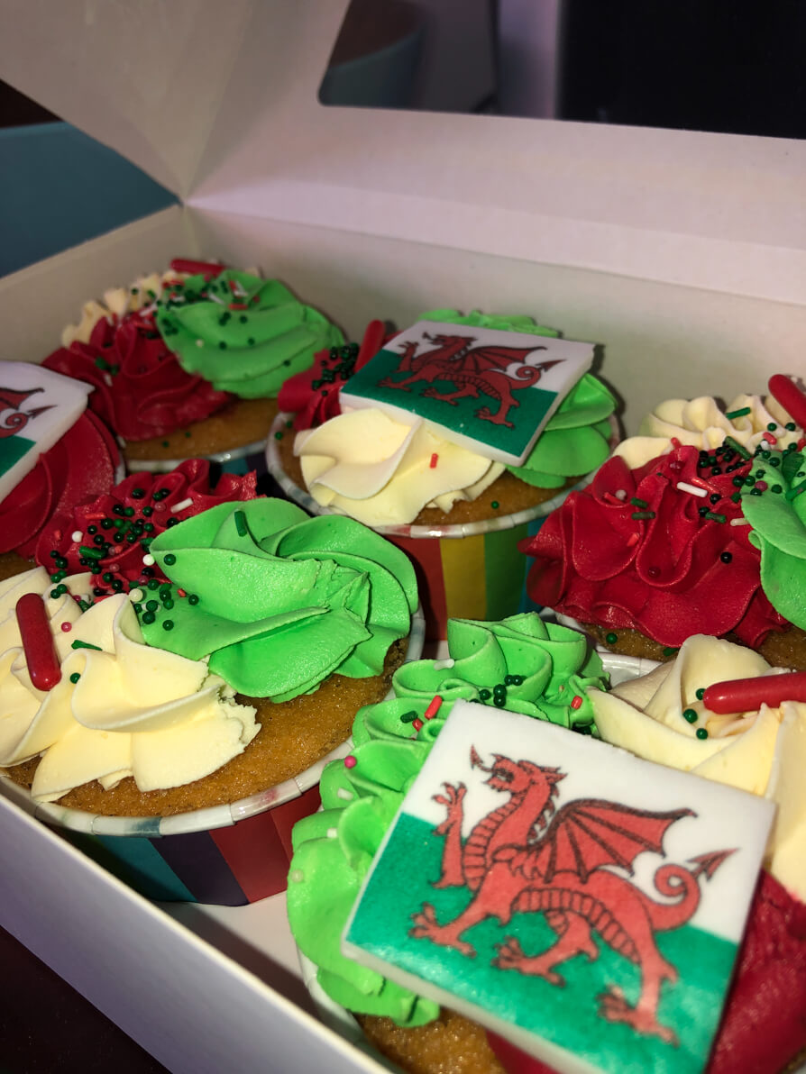Image of 6 cupcakes decorate with Welsh flag and colours