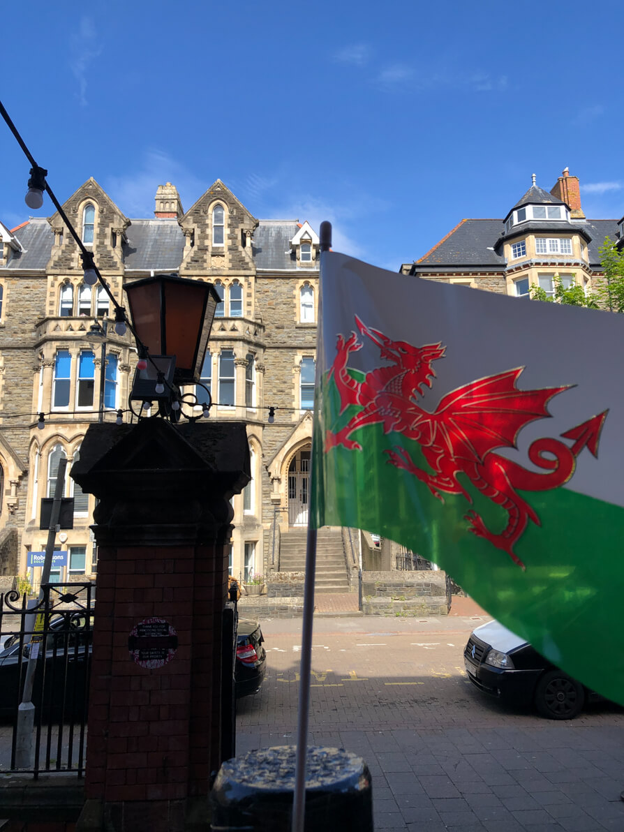 Image of Welsh flag flying outside pub in Cardiff
