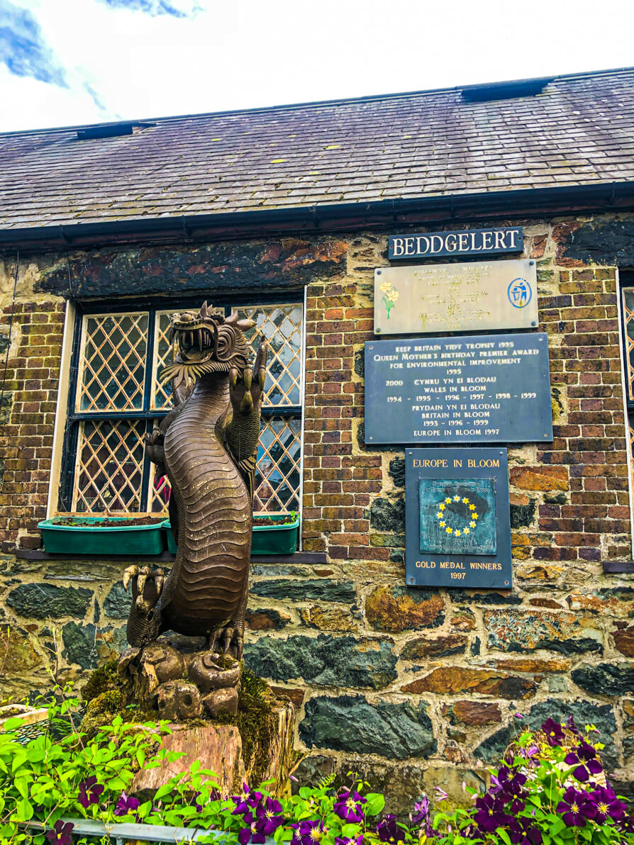 Beddgelert sign and dragon statue in Beddgelert village
