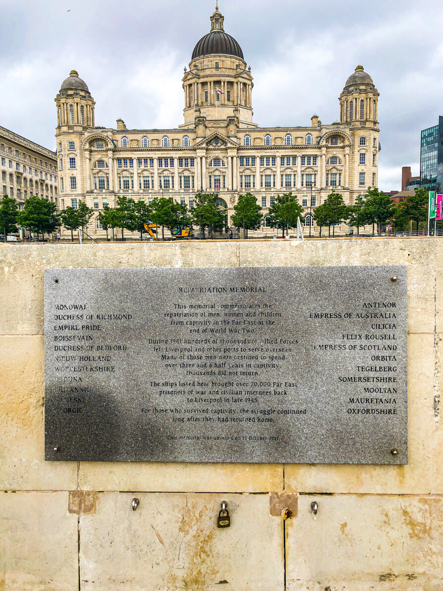 Port of Liverpool building in background with memorial in forefront in Liverpool