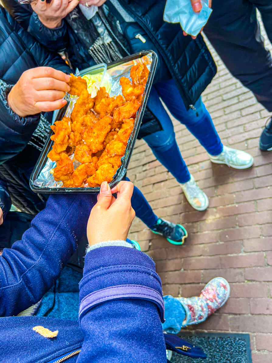 Kibbeling on Amsterdam Food Tour being handed out