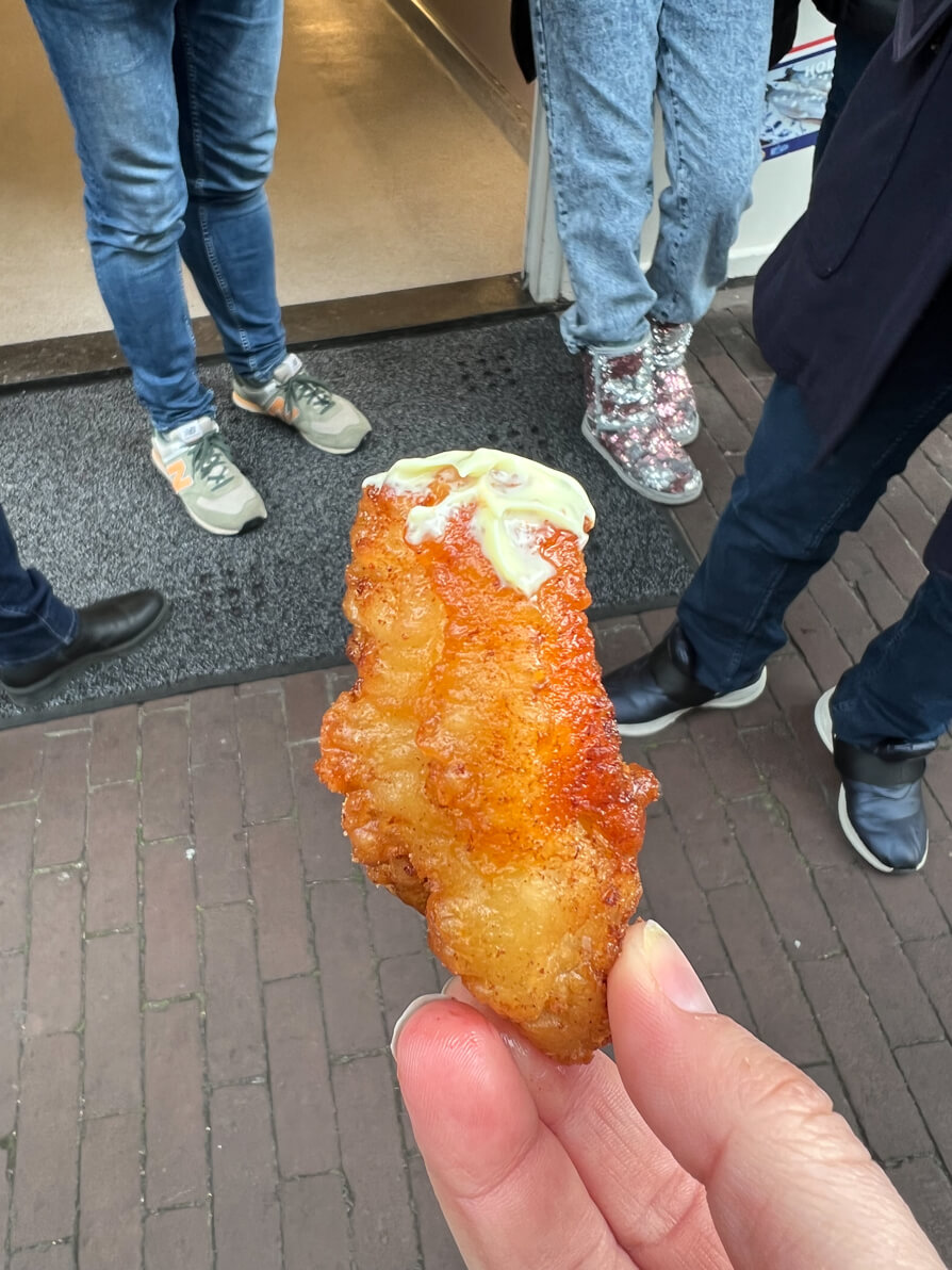 Piece of Kibbeling with secret sauce on Food Tour Amsterdam Eating Europe