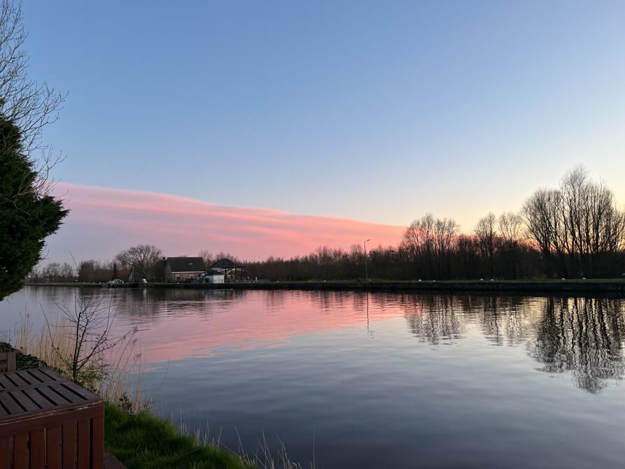 River Schie with pink sunset in Delft Netherlands