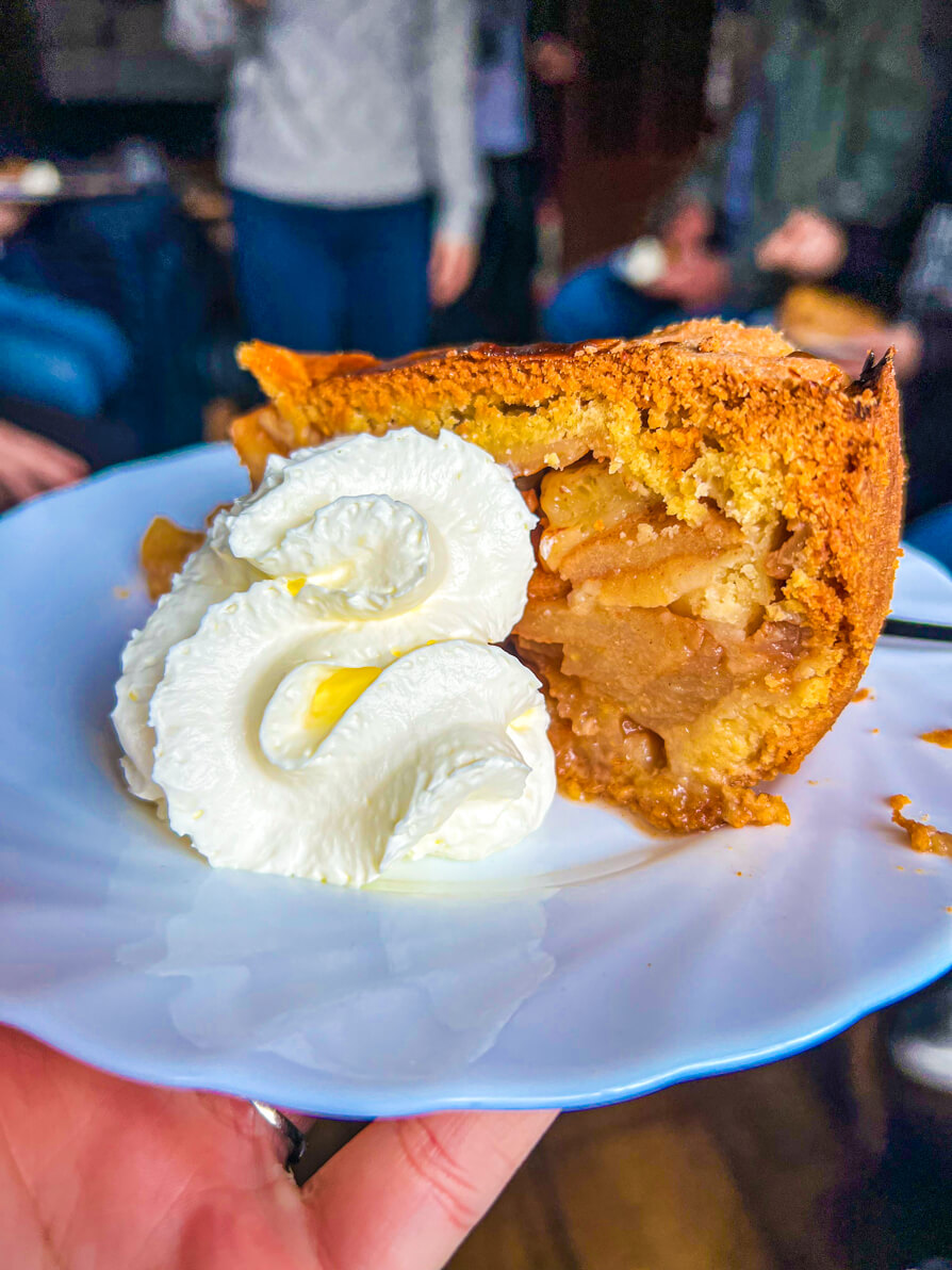 Delicious apple pie and whipped cream in Cafe Papeneiland Jordaan Amsterdam Food Tour