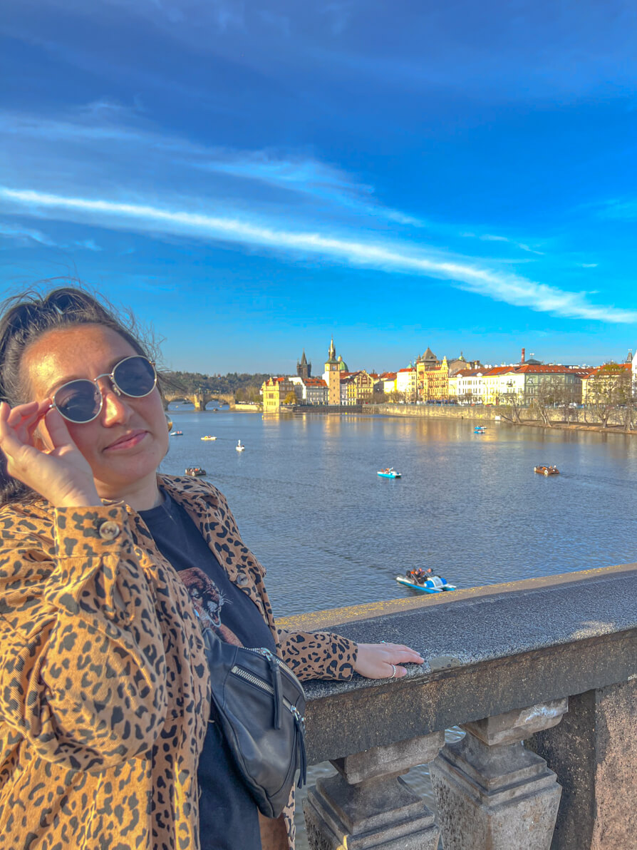 Shireen posing with Charles Bridge and Prague Old Town in background 
