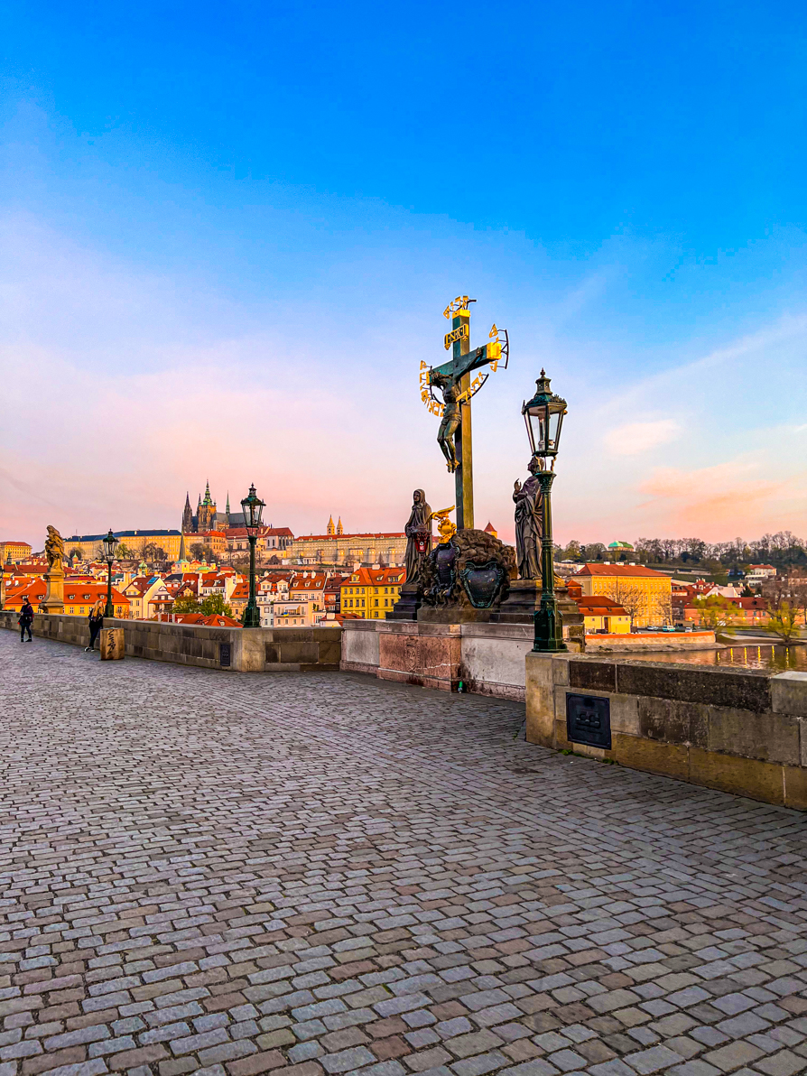 St John statue on Charles Bridge at sunrise in Prague