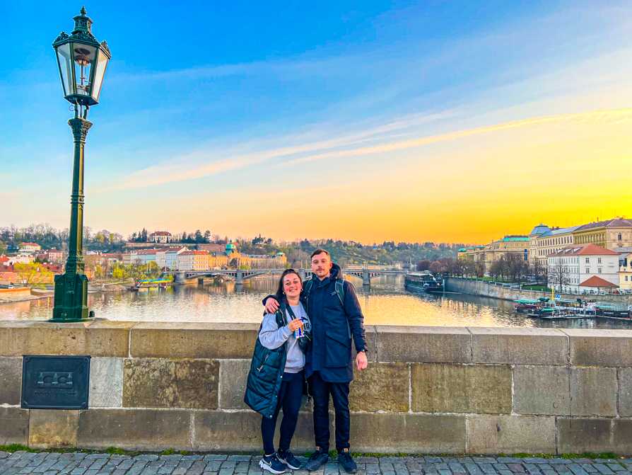 Shireen and Scott on Charles Bridge at sunrise in Prague