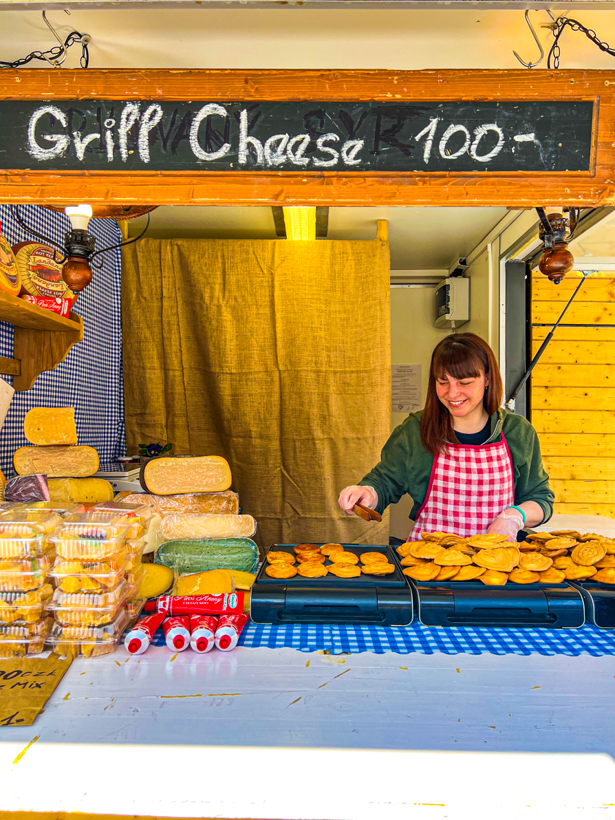 Grill Cheese stall with owner cooking in Prague