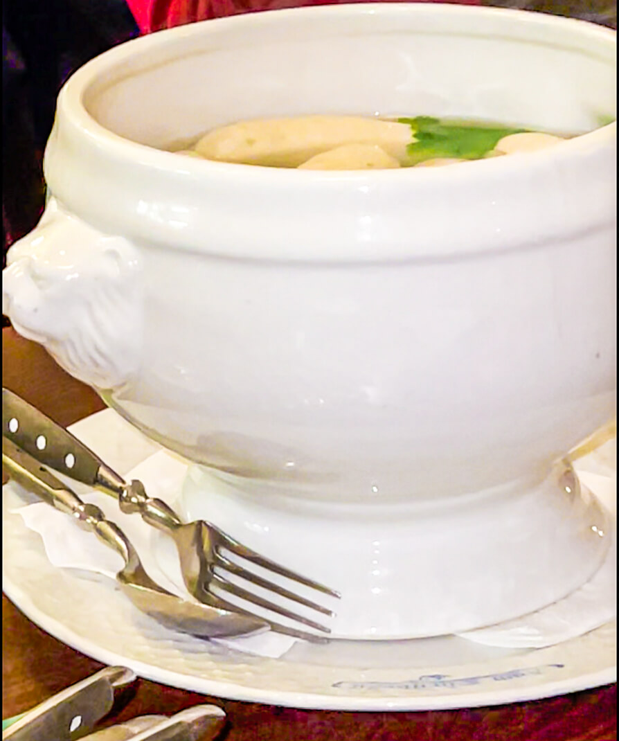 Weisswurst in large white bowl with cutlery to the side in Munich Fork and Walk Tours Location