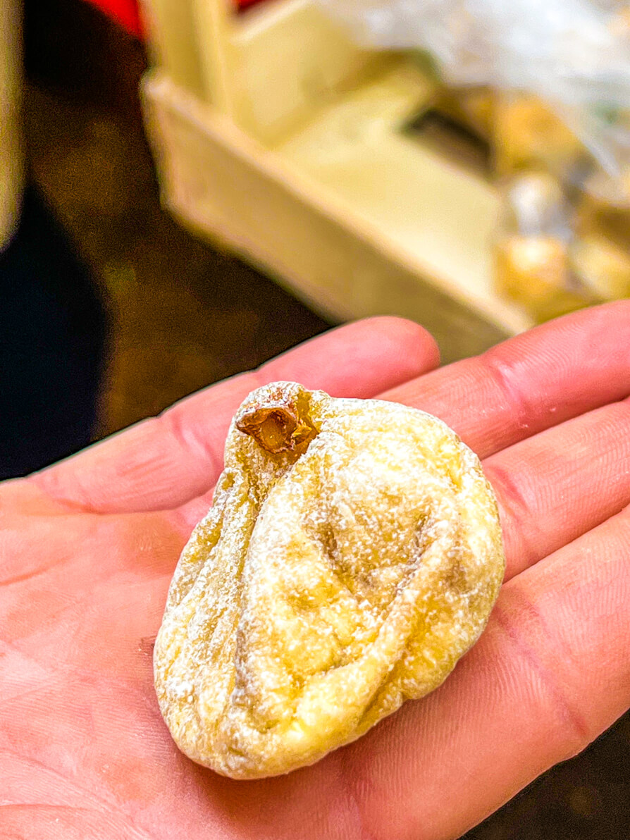 Up close shot of a dried fig in the hand of the Free Spirit Tours tour guide in Zadar Croatia