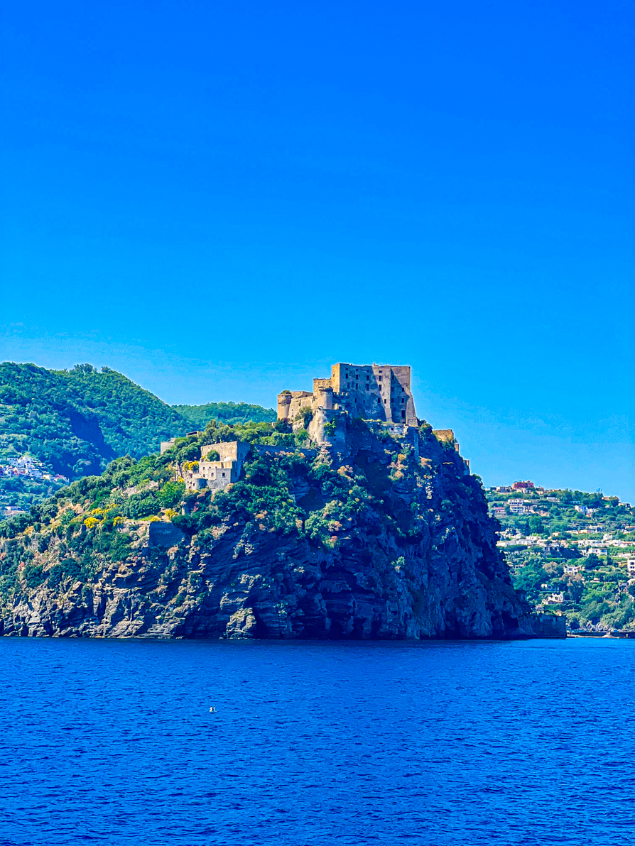 View of castle on Ischia from the ferry back to Naples