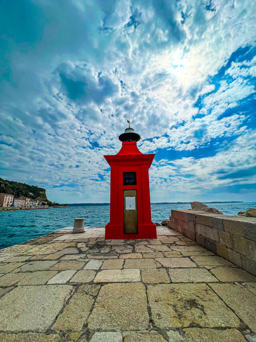 Image of red post at edge of port in Piran Slovenia