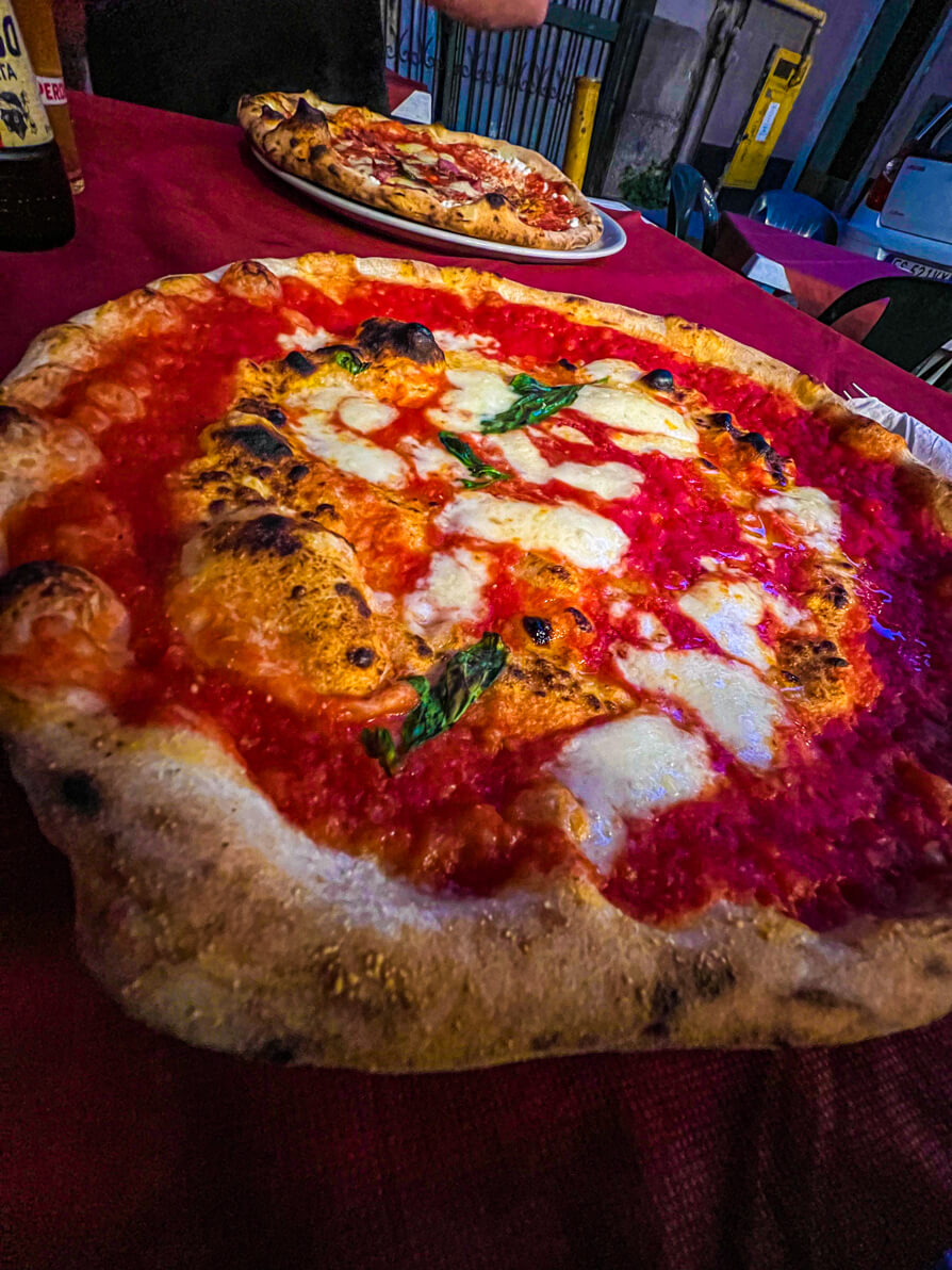 Image of two margarita pizzas in Antica Pizzeria Del Borgo in Naples Italy