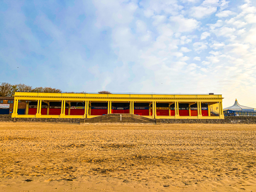 Image of Western Shelter from the beach view with blue sky and white clouds in sky
