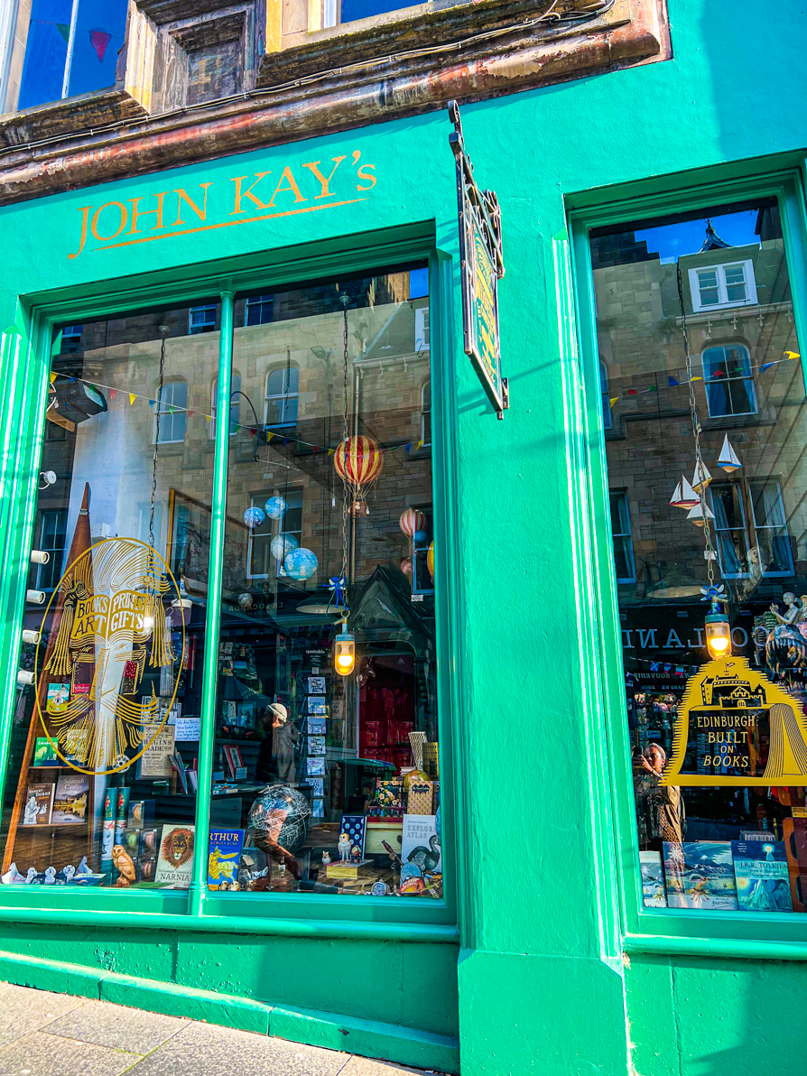 John Kay book shops as seen from outside. Green walls and window of books on Victoria Street Edinburgh