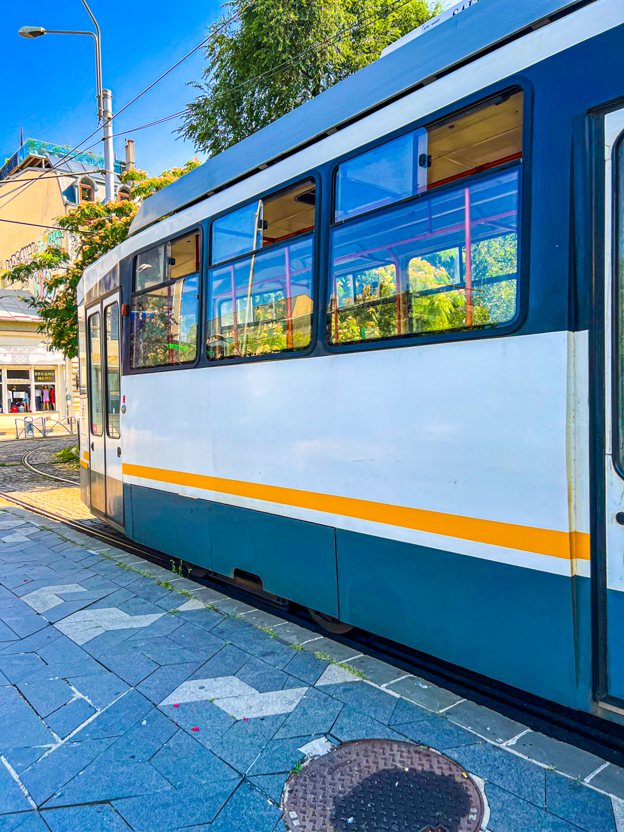 Image of outside of white tram in centre of Bucharest