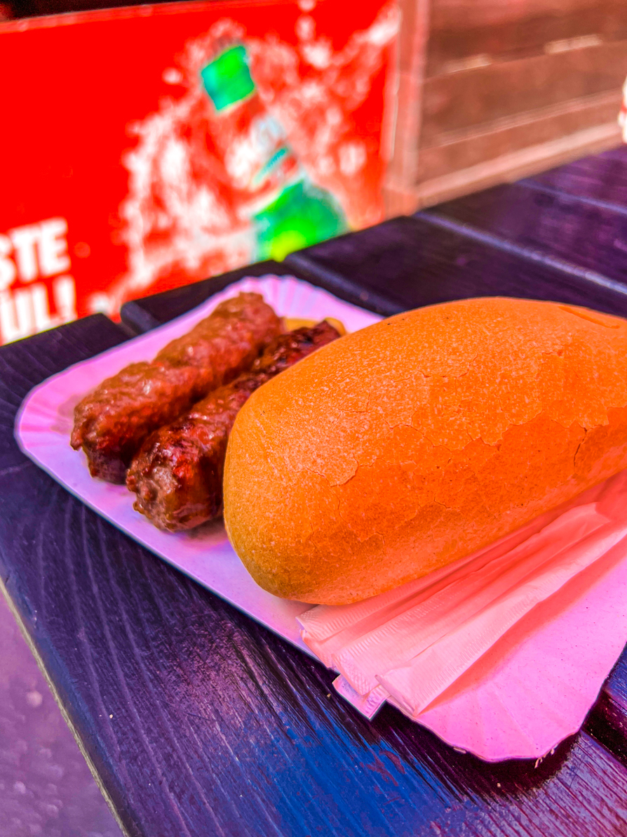 Side view of two mici and bread in Bucharest