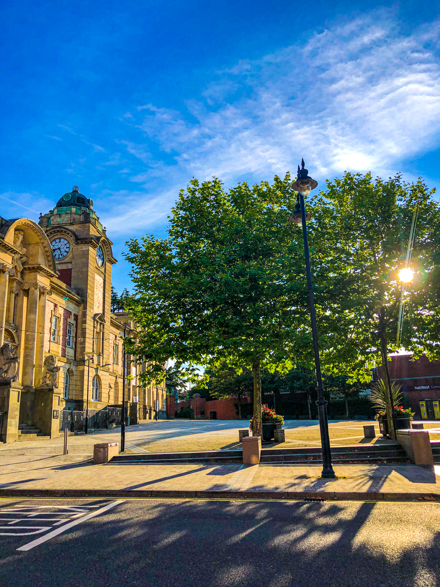 Image of King Square Barry from the Holton Road view with blue sky and green tree in background 