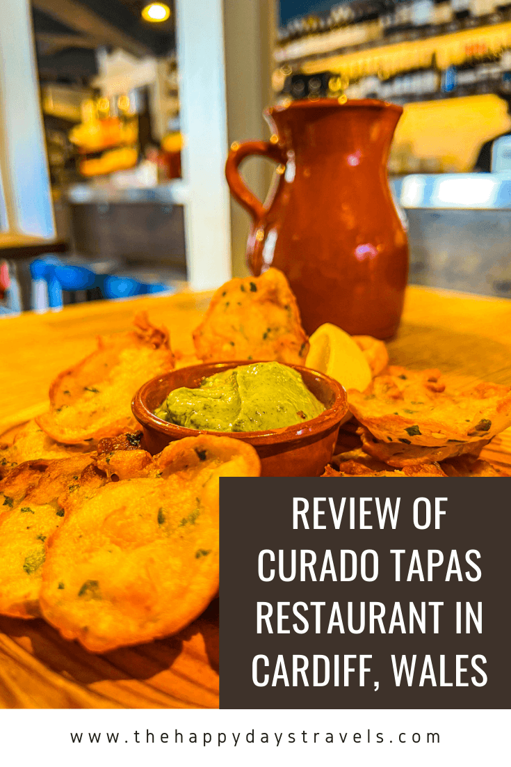 Pin image text reads 'Review of Curado Tapas Restaurant in Cardiff, Wales' with image of prawn tortilla fritters and brown jug in Curado Cardiff