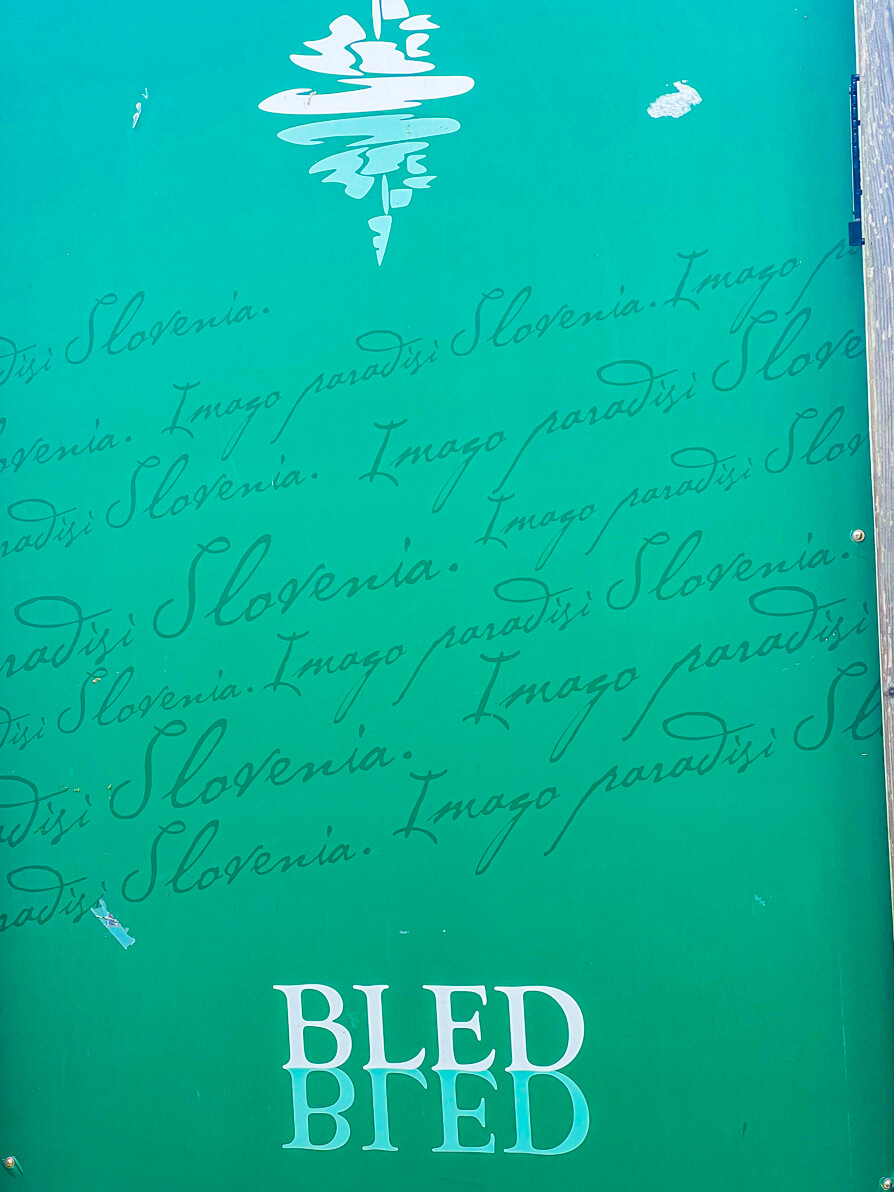 Image of green Bled sign on a noticeboard in Lake Bled Slovenia