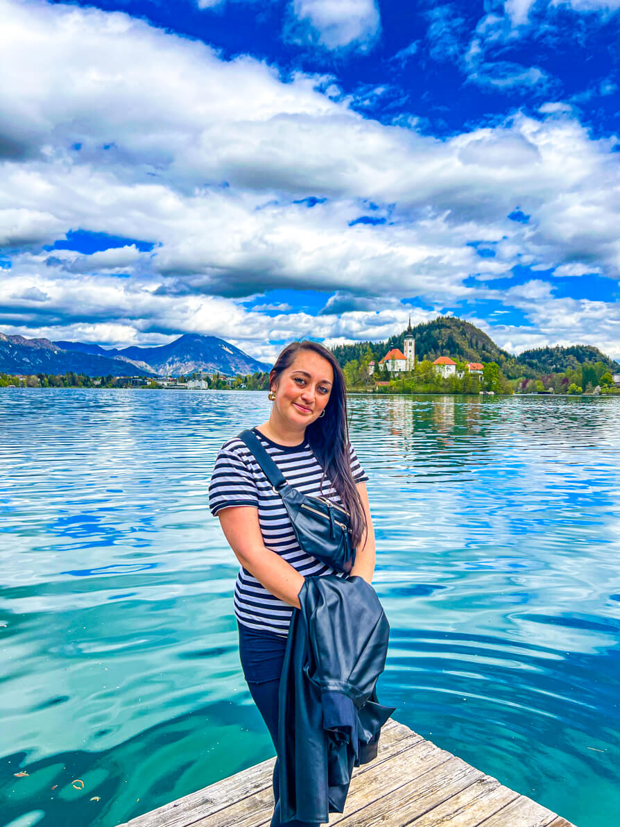 Image of Shireen smiling in front of Lake Bled in Bled Slovenia