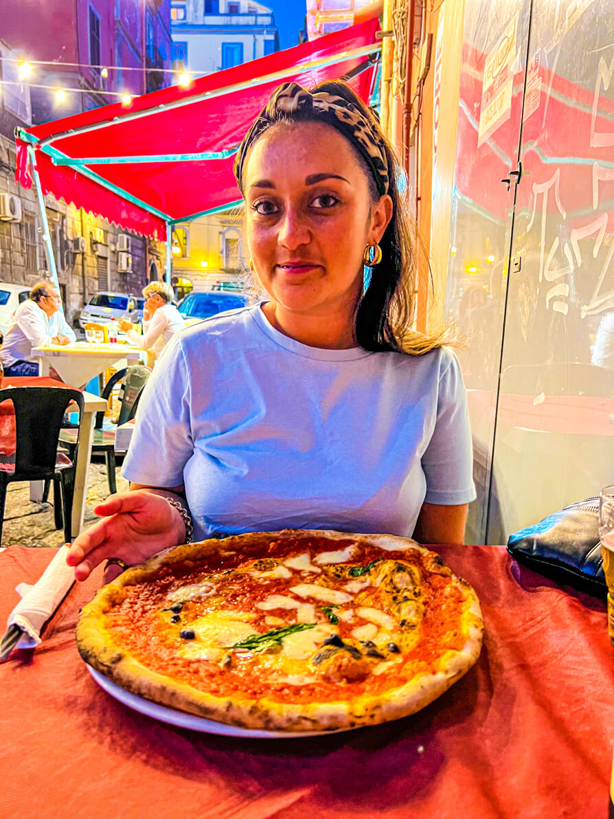Shireen with margarita pizza in Naples Italy