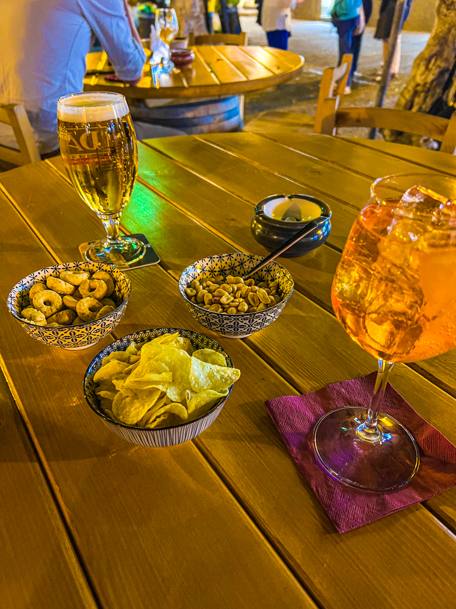 Image of Taralli as part of Apertivo table in Italy at night