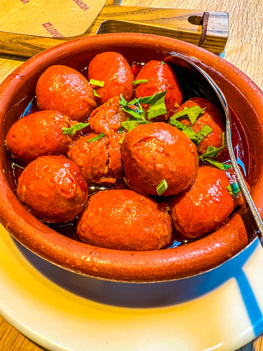 Image of bowl of Chorizo Balls in Cider in tapas dish at Curado Cardiff Wales