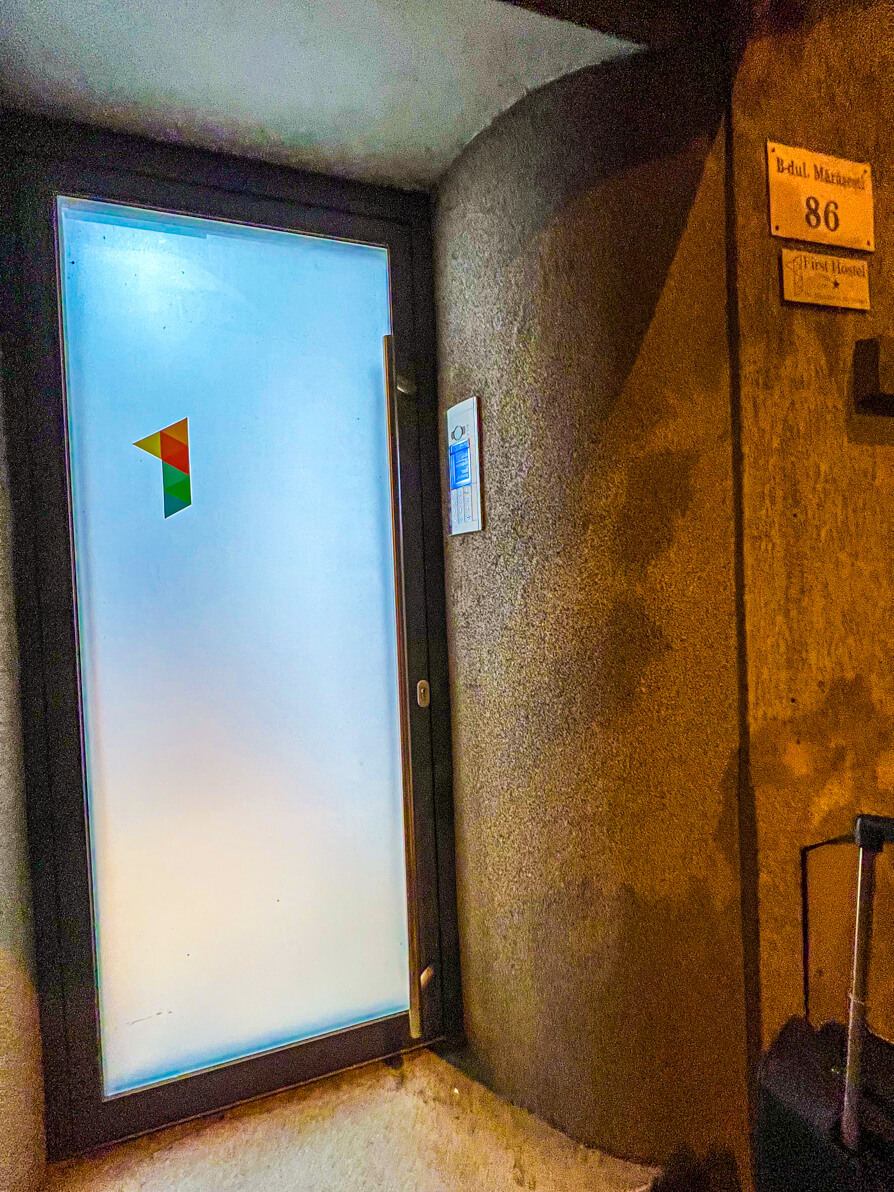 Image of First Hostel front door in Bucharest Romania at night