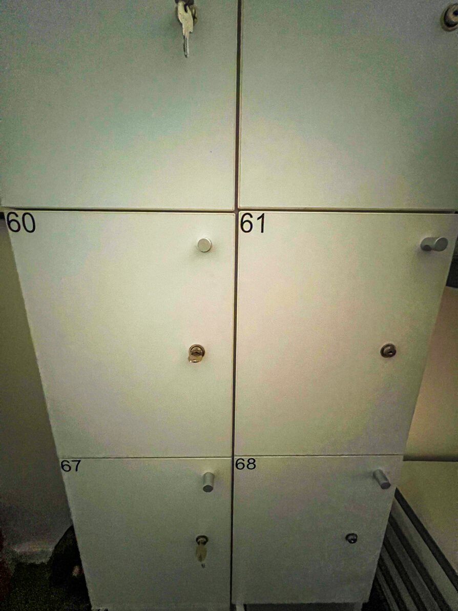 Image of 6 white lockers in bedroom of First Hostel Bucharest Romania
