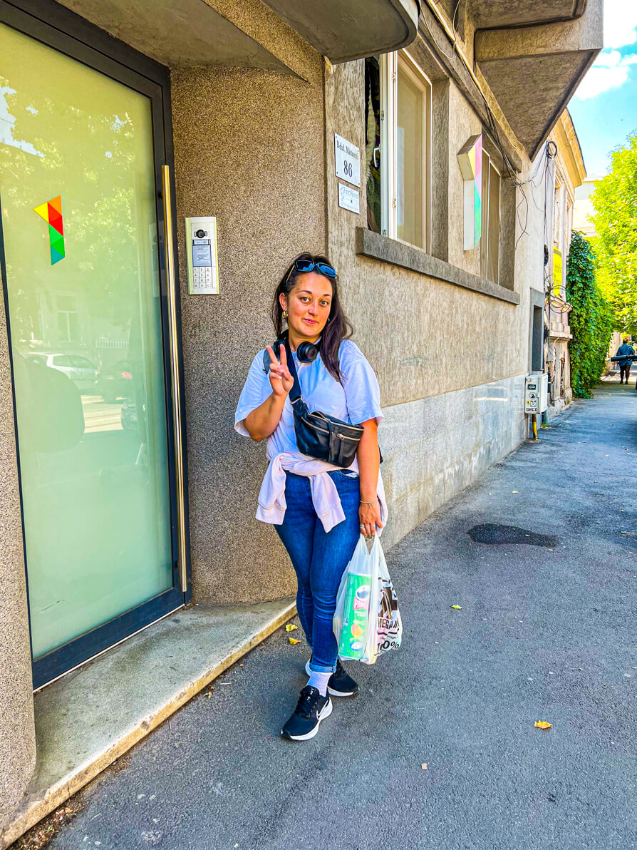 Image of Shireen standing outside First Hostel entrance in Bucharest Romania