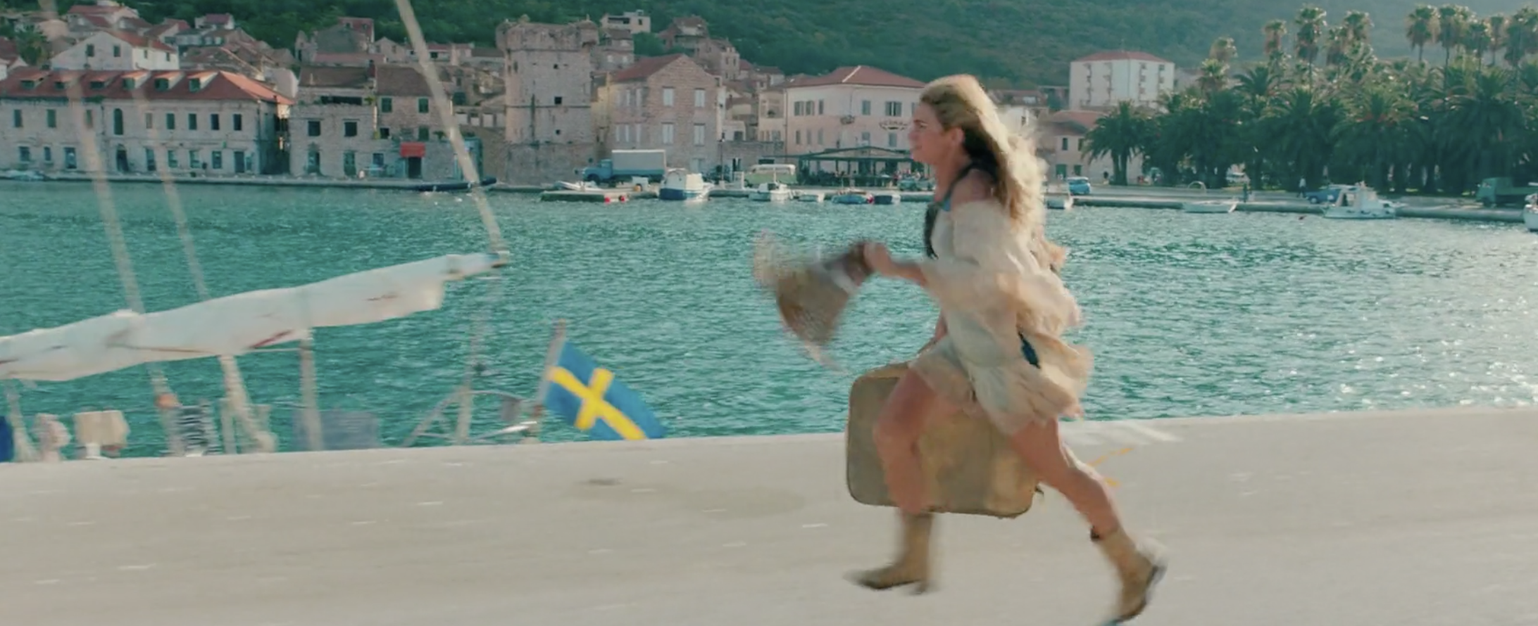 Image belongs to Universal Pictures. Young Donna running on the port used in Mamma Mia II