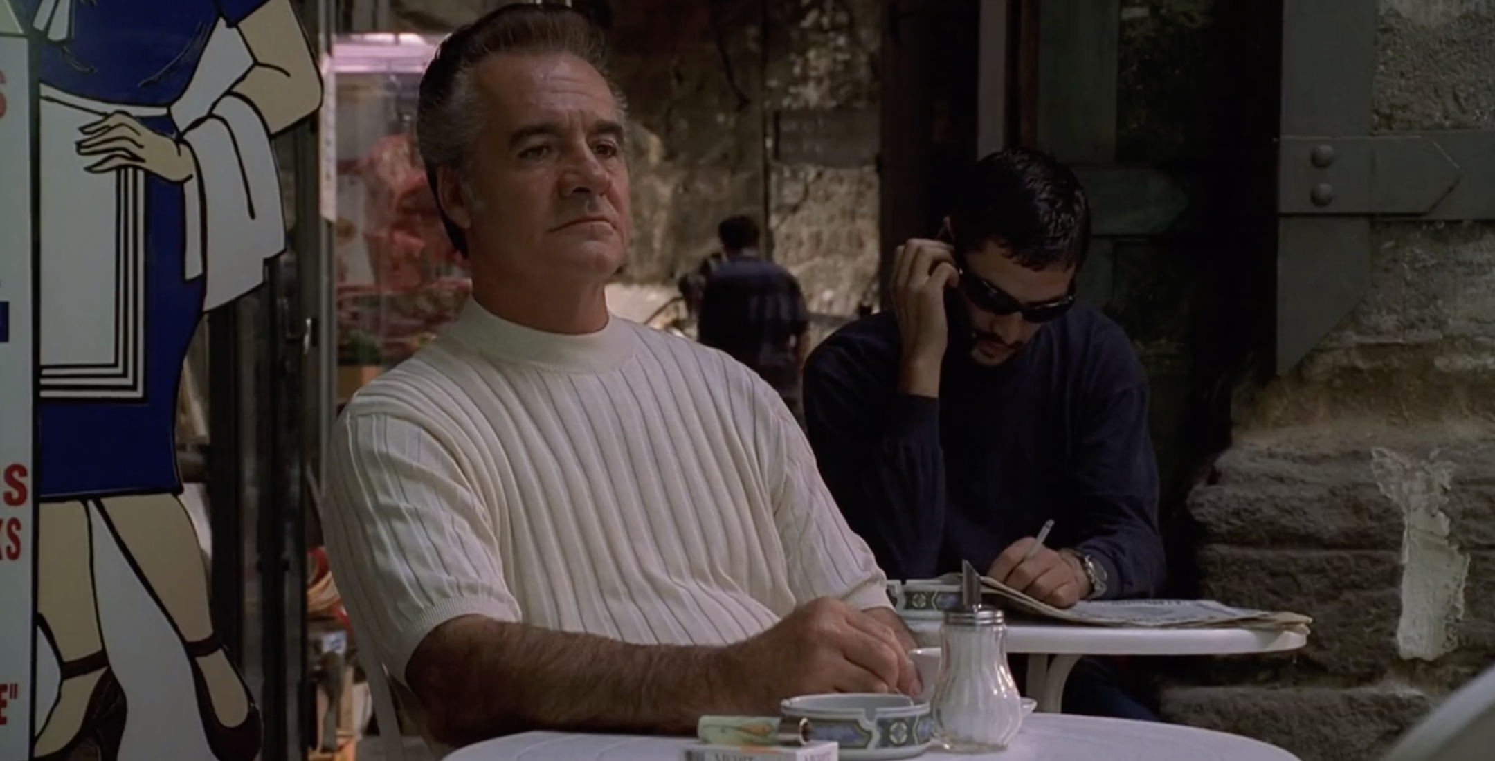 HBO/Entertainment image credit. Image of Paulie sitting at a table in Naples Italy