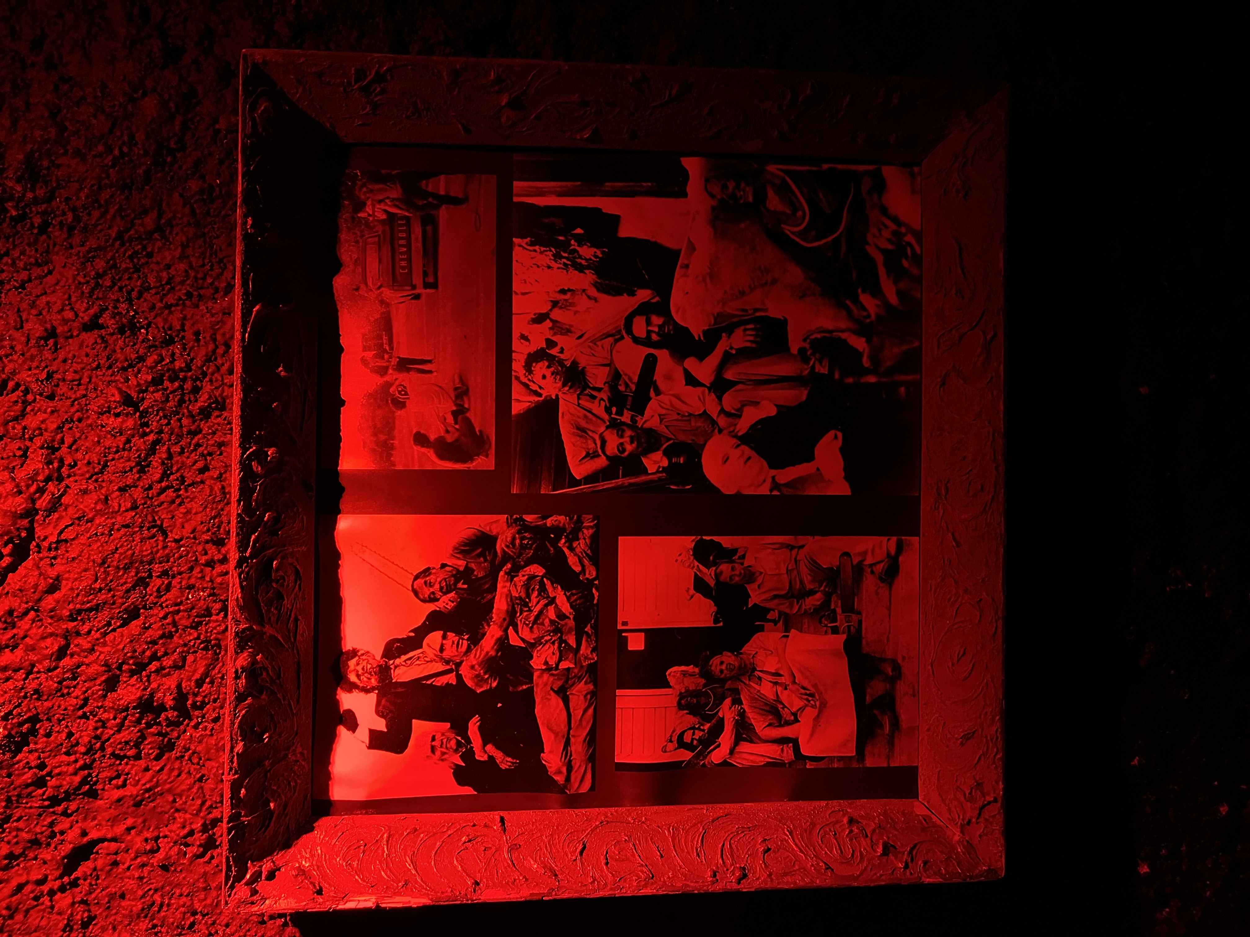 Image of framed photos on the wall in Prague Nightmare Horror Bar