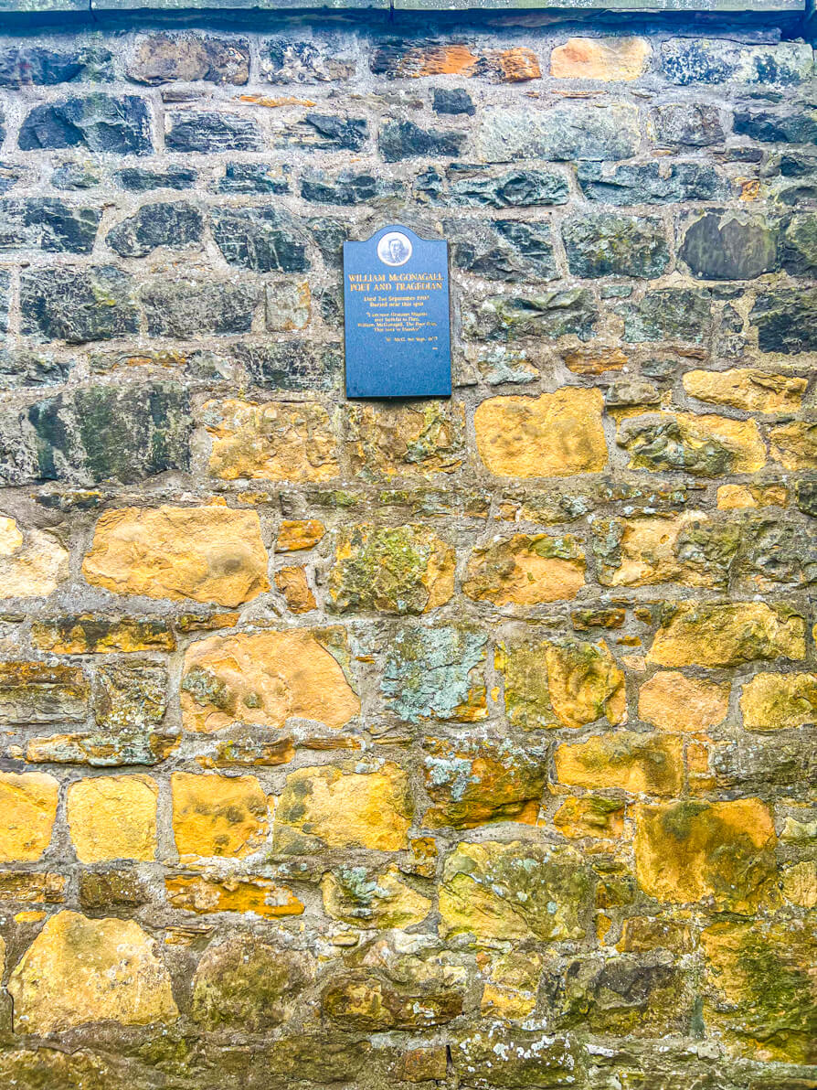 Wide shot Image of William McGonagall plaque in Greyfriars Kirkyard Harry Potter Graveyard in Edinburgh Scotland