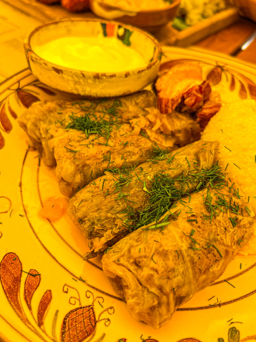 Image of Sarmale and Mamaliga, deep fried Pork and Sour Cream in Brasov Romania