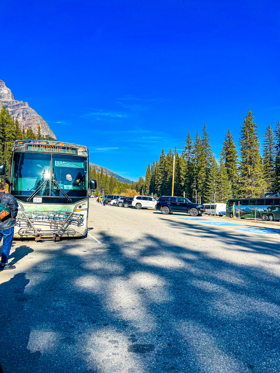 Image of roam transit bus parked at Moraine Lake in October